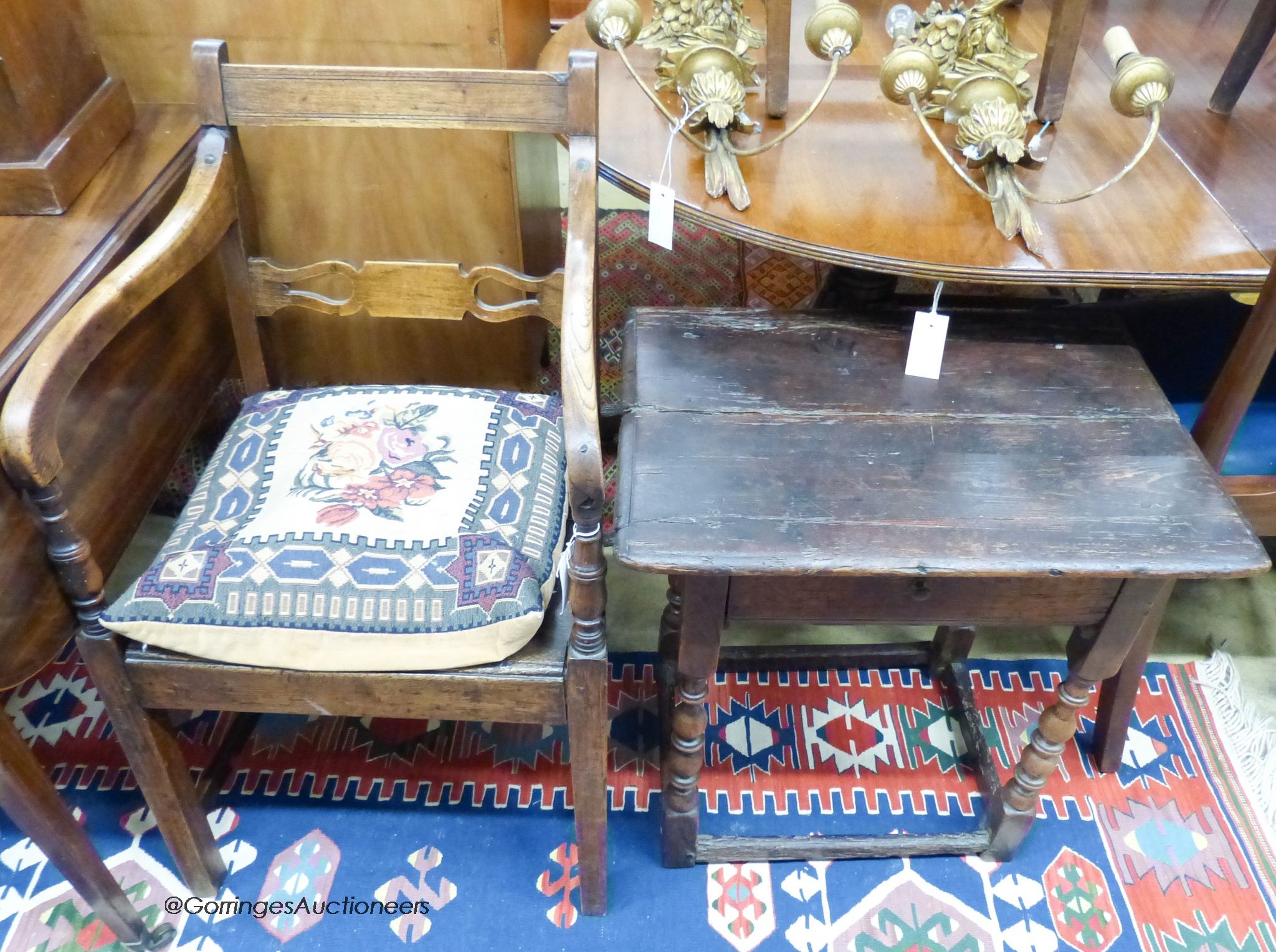 An 18th century oak and pine side table, width 59cm, depth 42cm, height 58cm and an early 19th century elm and beech provincial elbow chair